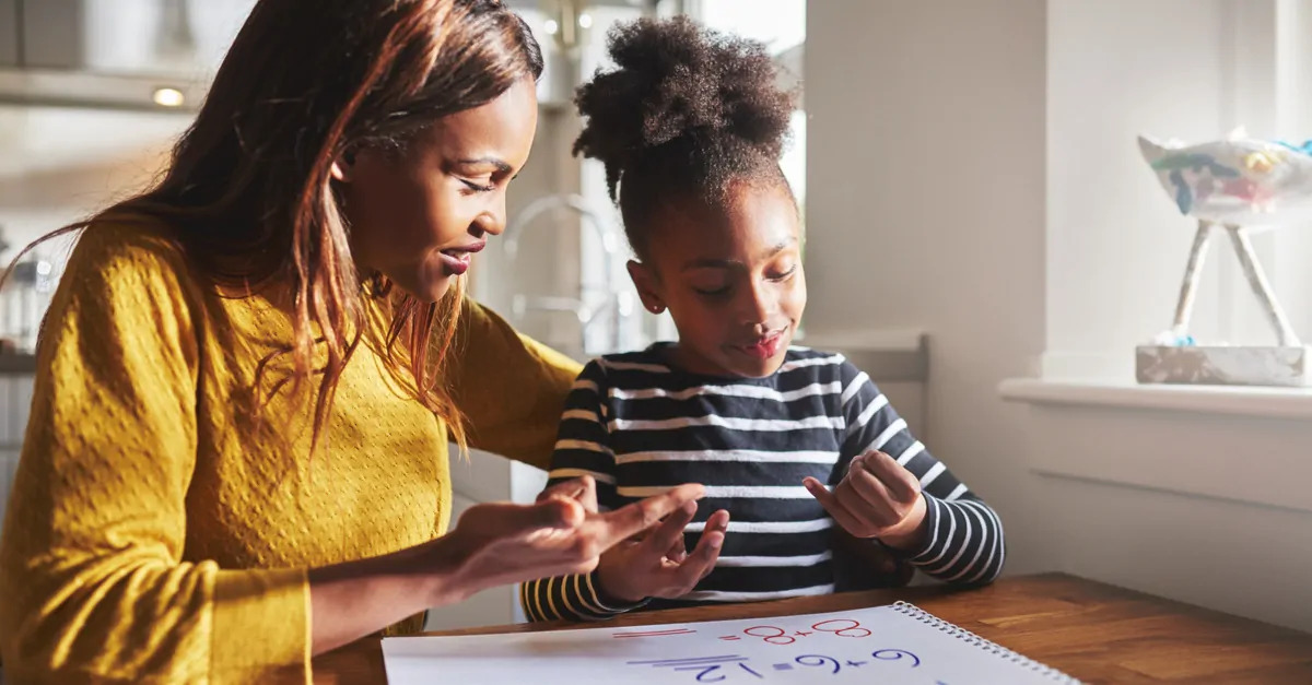 mother helps daughter with math